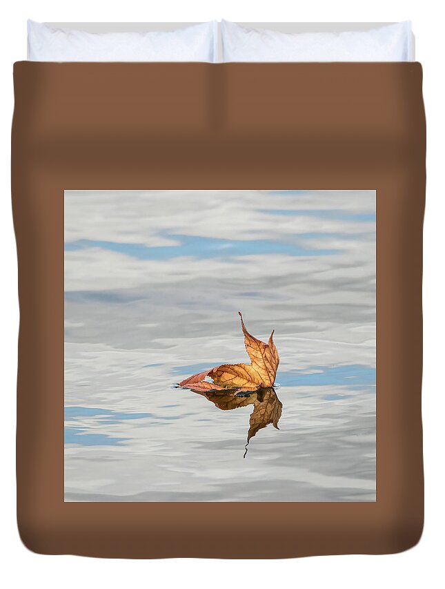 Evergreen Lake Duvet Cover featuring the photograph Leaf on Water by Ray Silva