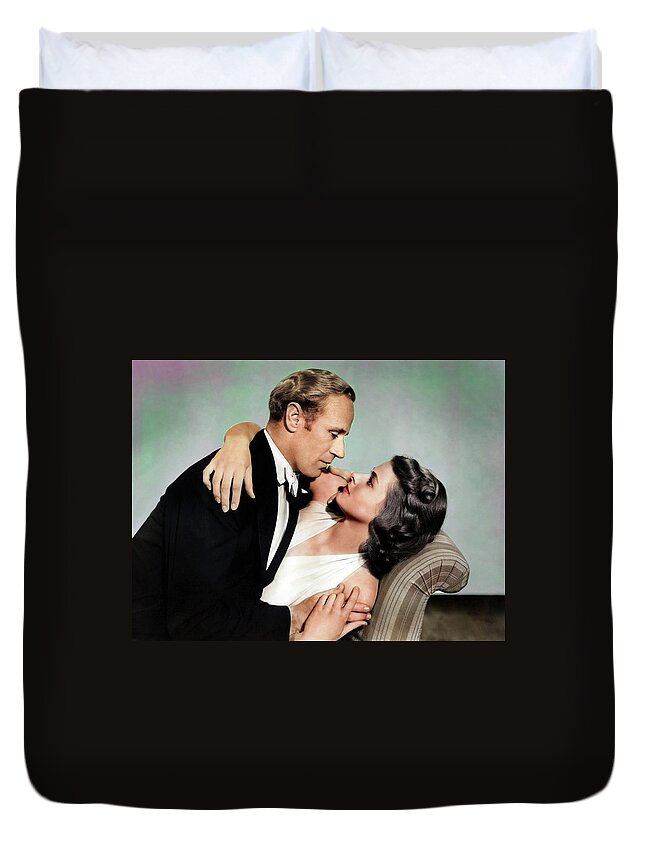 Leslie Duvet Cover featuring the photograph Leslie Howard and Ingrid Bergman by Movie World Posters