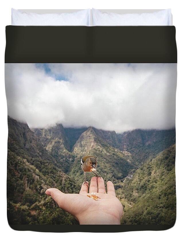Balcoes Viewpoint Duvet Cover featuring the photograph Madeiran chaffinch has flown to the man's hand for food crumbs by Vaclav Sonnek
