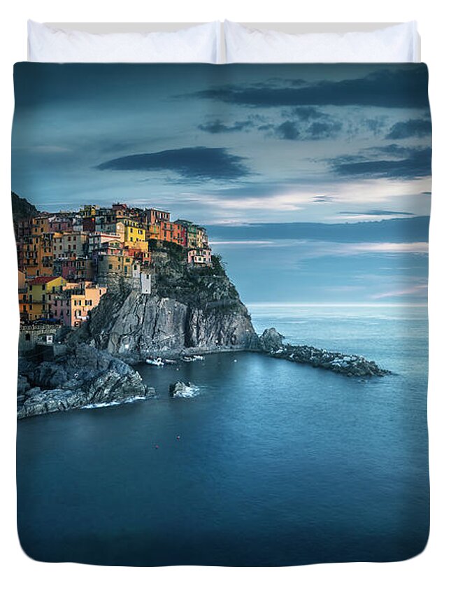 Manarola Duvet Cover featuring the photograph Manarola village, rocks and sea in blue hour. Cinque Terre, Ital by Stefano Orazzini