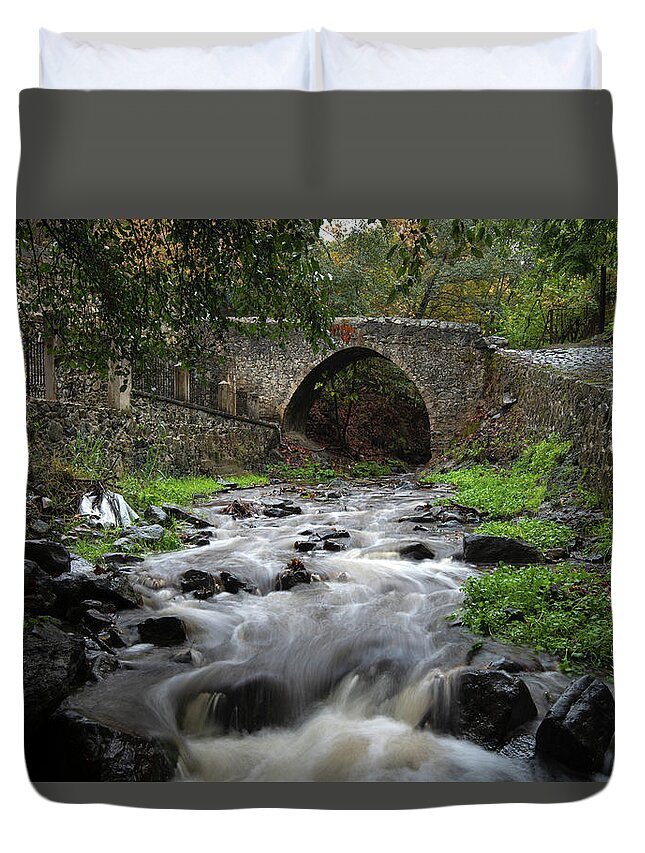 River Duvet Cover featuring the photograph Medieval stoned bridge water flowing in the river. by Michalakis Ppalis