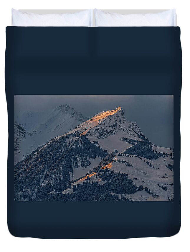 Goldswil Duvet Cover featuring the photograph Morning light in a snow storm by Ulrich Burkhalter