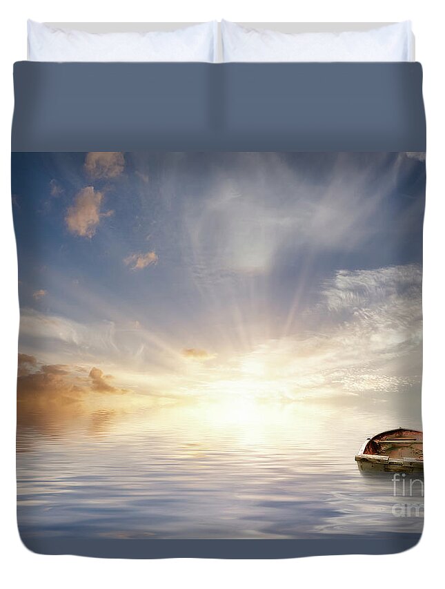 Ocean Duvet Cover featuring the photograph Old Rowing Boat Adrift At Sea by Simon Bratt