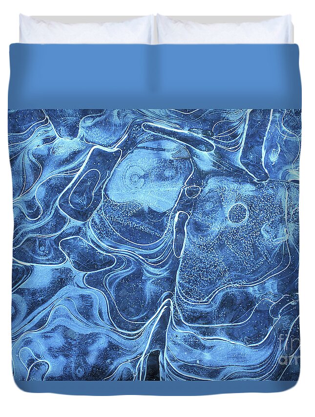 Ice Pattern Duvet Cover featuring the photograph Patterns in the ice of a frozen lake by Neale And Judith Clark