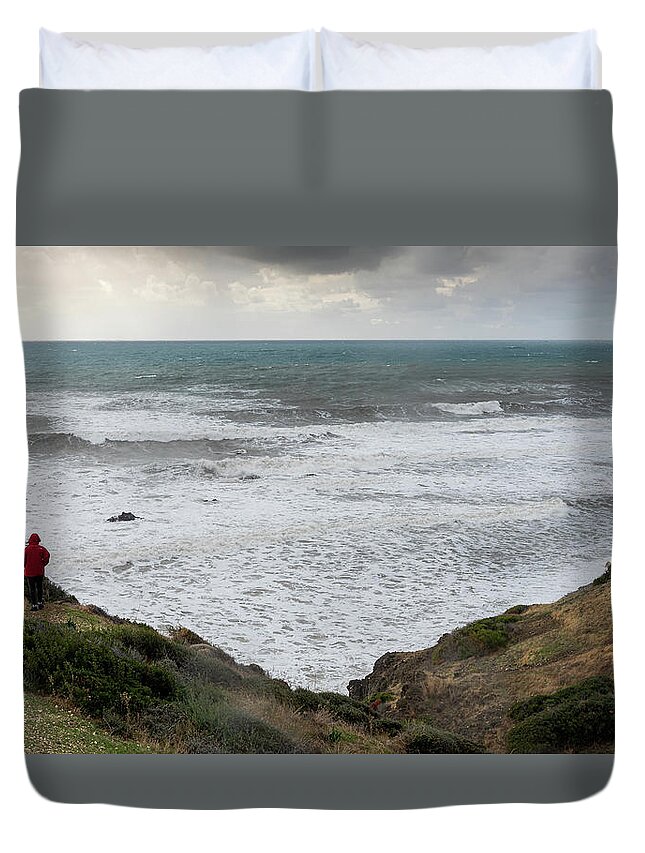 Seascape Duvet Cover featuring the photograph Person standing the edge of a cliff end enjoying th by Michalakis Ppalis