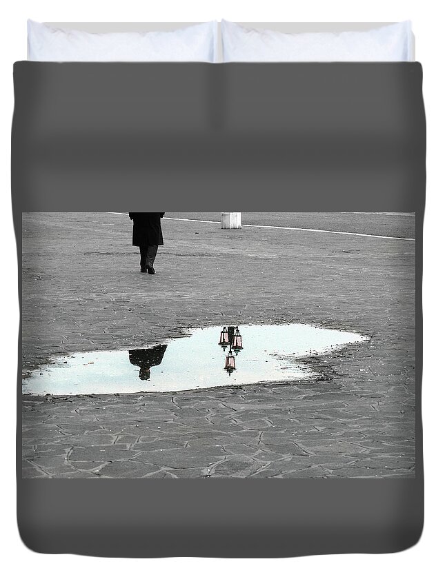 Puddle Duvet Cover featuring the photograph Reflection of a man in a puddle by Fabiano Di Paolo