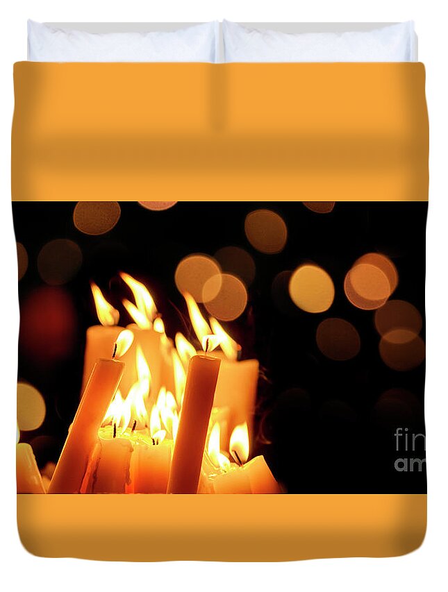 Candle Duvet Cover featuring the photograph Religious candles in front of bokeh light by Jelena Jovanovic