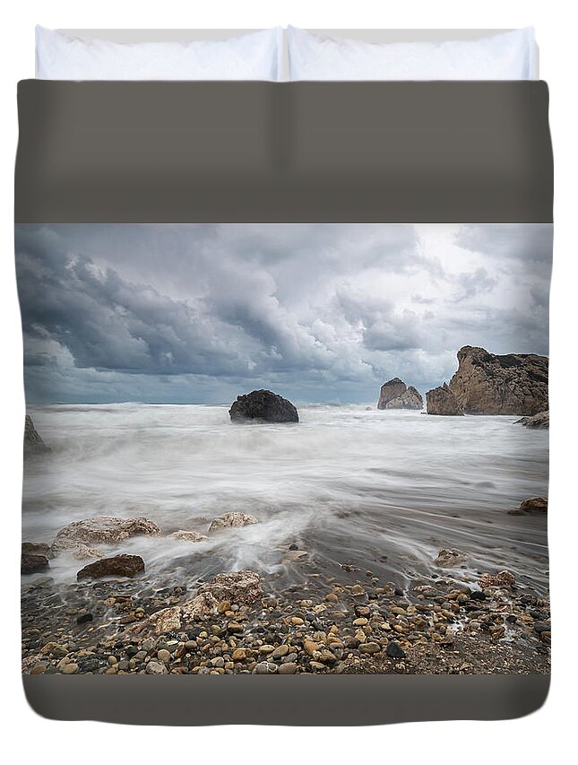 Seascape Duvet Cover featuring the photograph Seascape with windy waves during storm weather at the a rocky co by Michalakis Ppalis