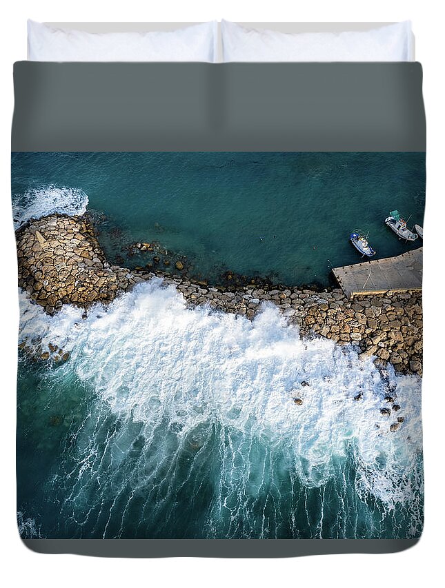 Brakewater Duvet Cover featuring the photograph Stormy windy waves on the shore. Drone photography. by Michalakis Ppalis