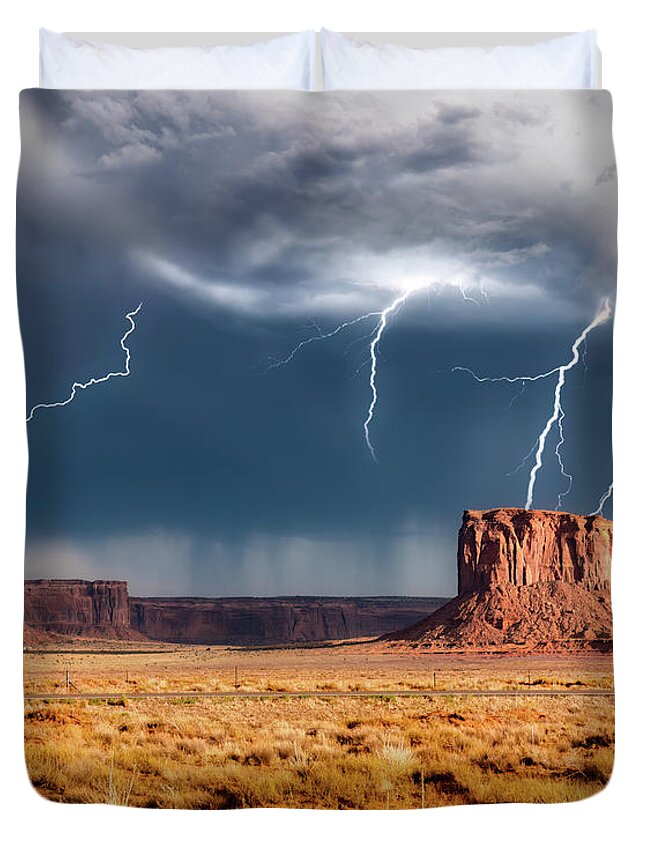 Sunset Duvet Cover featuring the photograph Strike in Monument Valley by G Lamar Yancy