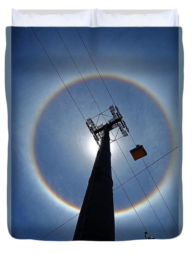 Sun Halo Duvet Cover featuring the photograph Sun halo and cable car pylon La Paz Bolivia by James Brunker