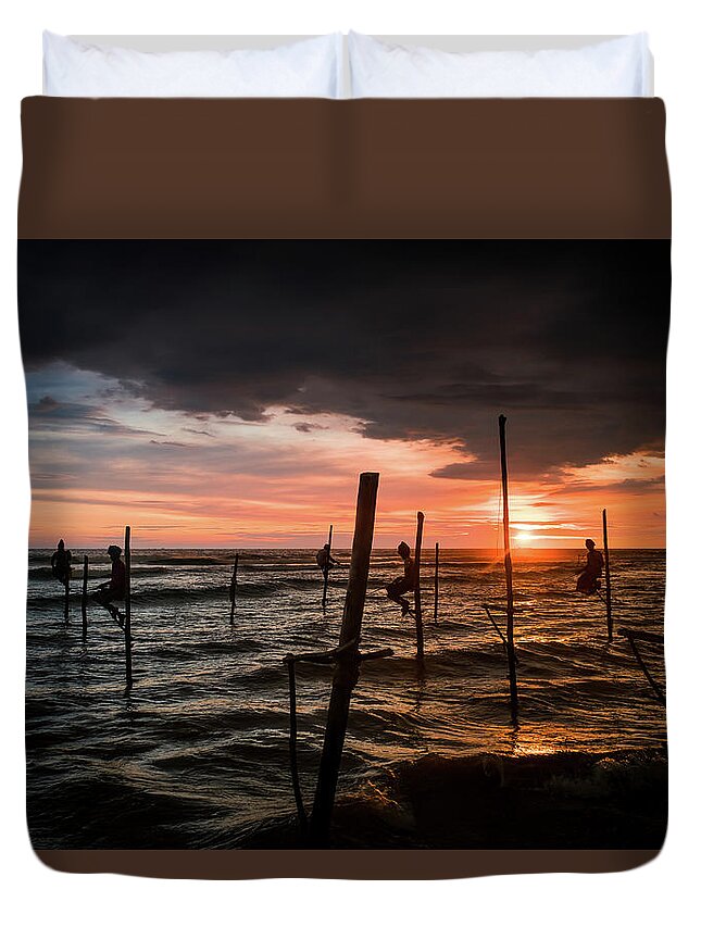 Fisherman Duvet Cover featuring the photograph Sunset and Stilt Fishermen by Arj Munoz