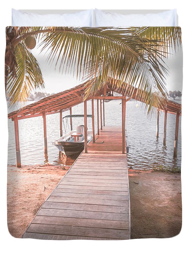 African Duvet Cover featuring the photograph Swaying Palms Over the Dock in Pale Colors by Debra and Dave Vanderlaan