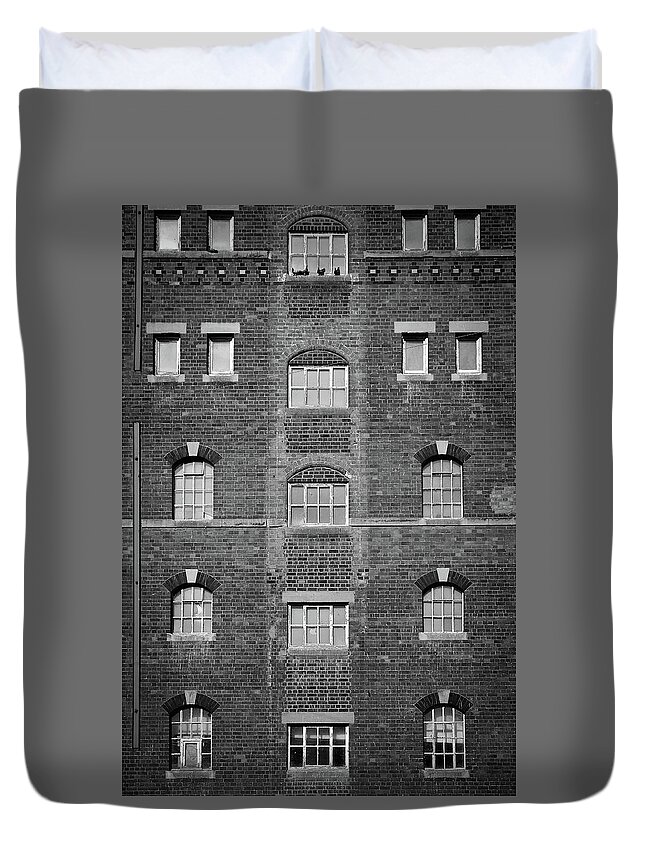 Background Duvet Cover featuring the photograph Symmetrical Industrial building windows by Seeables Visual Arts