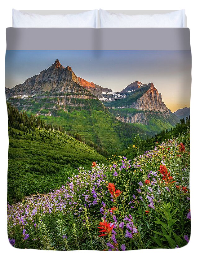 Landscape Duvet Cover featuring the photograph Wild flowers at sunset in Glacier National Park by Robert Miller