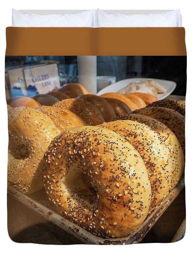 Appetizer Duvet Cover featuring the photograph Tray of bagels in a bakery. by Kyle Lee