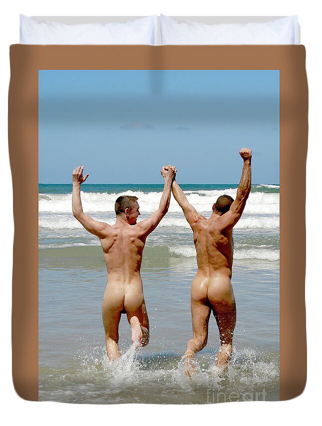 Gay Love Duvet Cover featuring the photograph Two male nudes playing at the beach by Gunther Allen