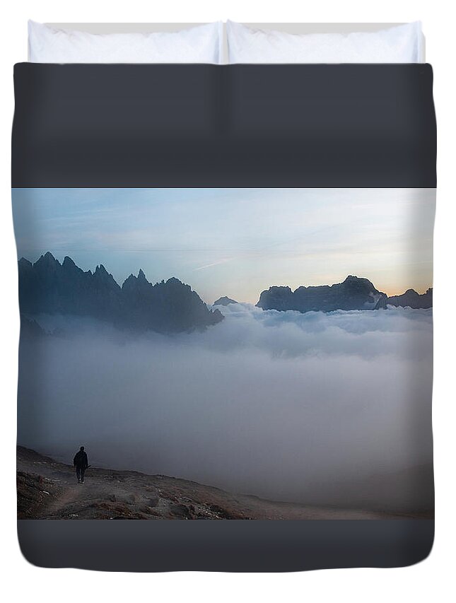Italian Alps Duvet Cover featuring the photograph Unrecognized man trekking at the hiking path at Tre Cime in South Tyrol in Italy. by Michalakis Ppalis