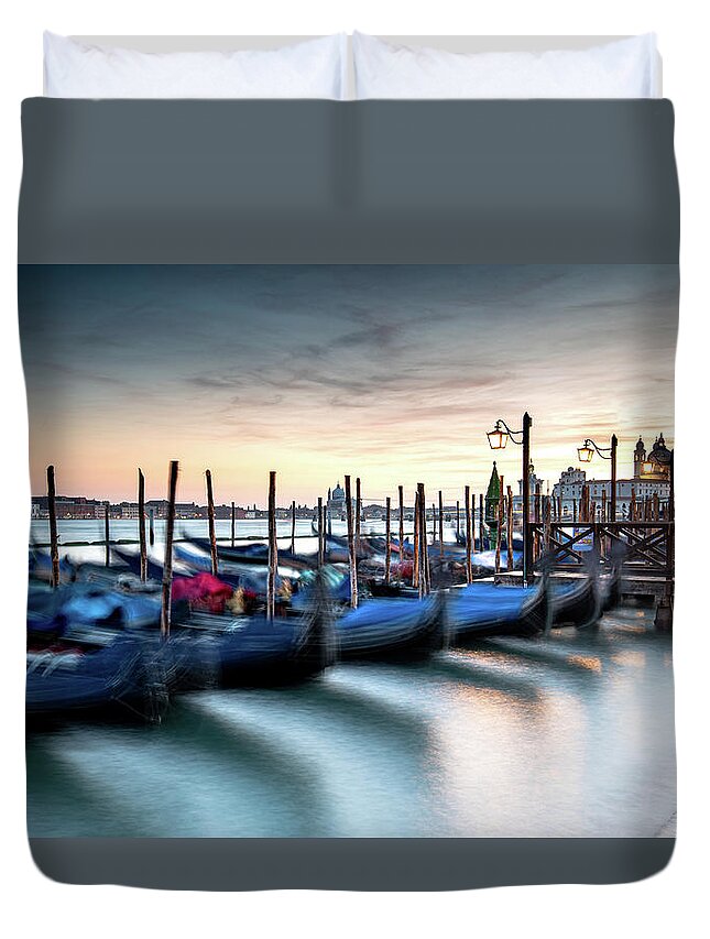 Gondola Duvet Cover featuring the photograph Venice Gondolas moored at the San Marco square. by Michalakis Ppalis