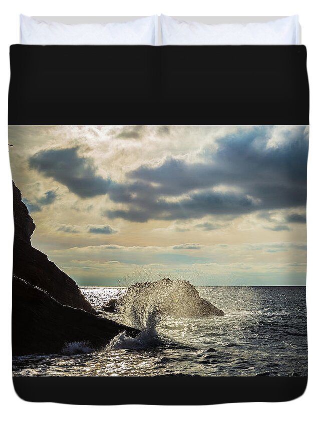 Wave Duvet Cover featuring the photograph Wave crashing on rocks by Fabiano Di Paolo