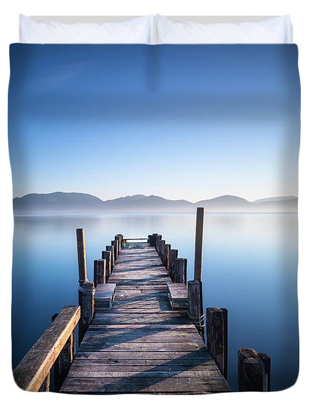 Lake Duvet Cover featuring the photograph Pier in a Blue Lake by Stefano Orazzini