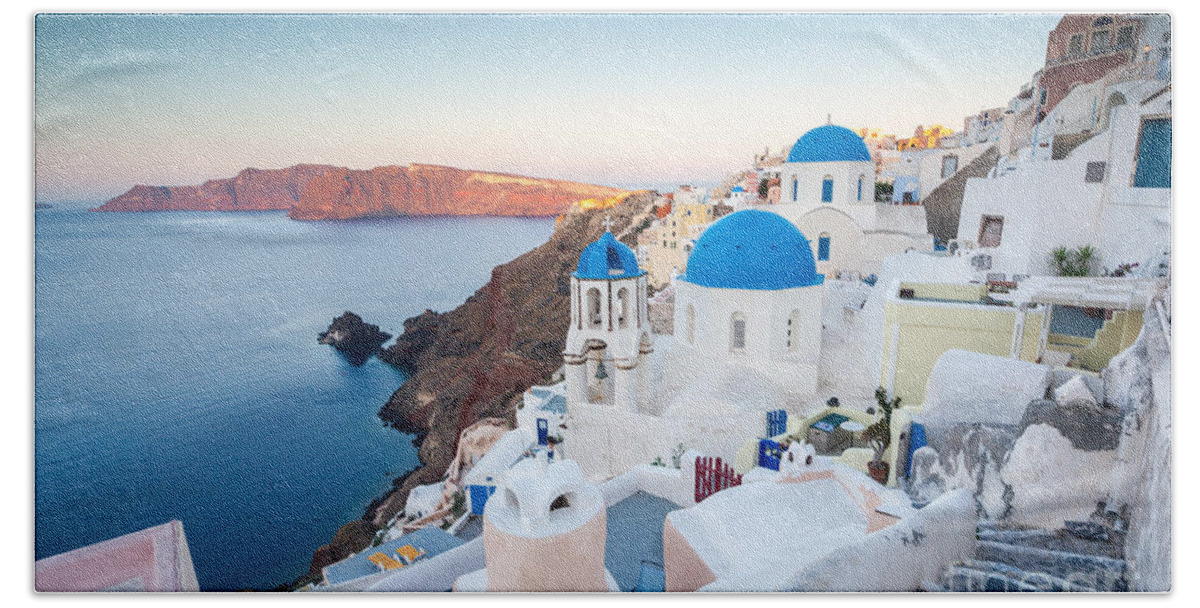 Santorini Bath Towel featuring the photograph Beautiful village of Oia at sunrise - Santorini - Greece #1 by Matteo Colombo