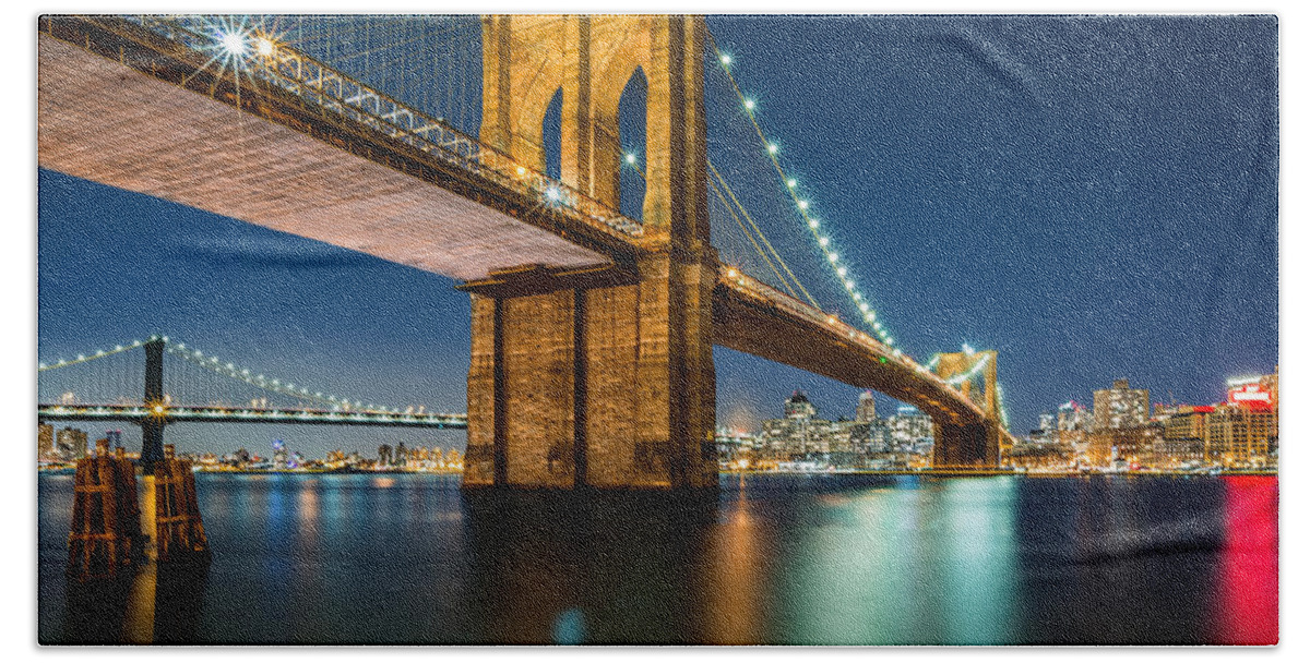 Architecture Bath Towel featuring the photograph Illuminated Brooklyn Bridge by night #1 by Mihai Andritoiu