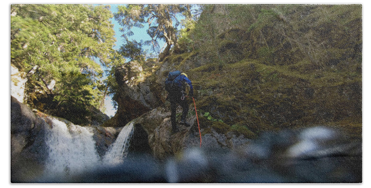 Abseil Hand Towel featuring the photograph Man Canyoning Down A Waterfall #1 by Frank Huster