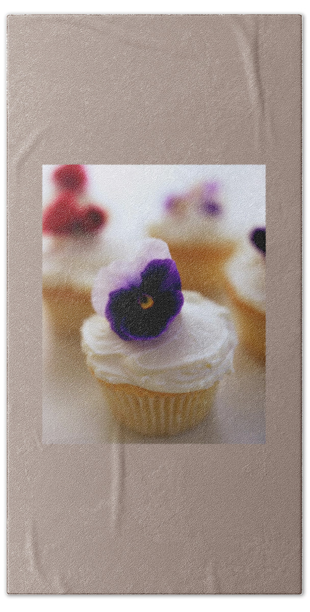A Cupcake With A Violet On Top Bath Towel