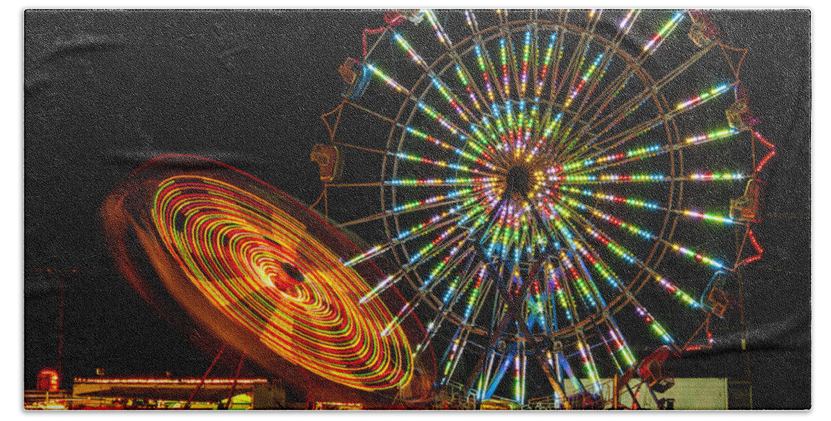 Colorful Carnival Ferris Wheel Ride At Night Prints Hand Towel featuring the photograph Colorful Carnival Ferris Wheel Ride at Night by Jerry Cowart