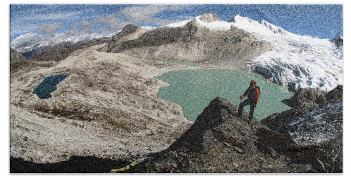 Bhutan Hand Towel featuring the photograph A Lone Hiker Stands Atop A Himalaya by Peter McBride