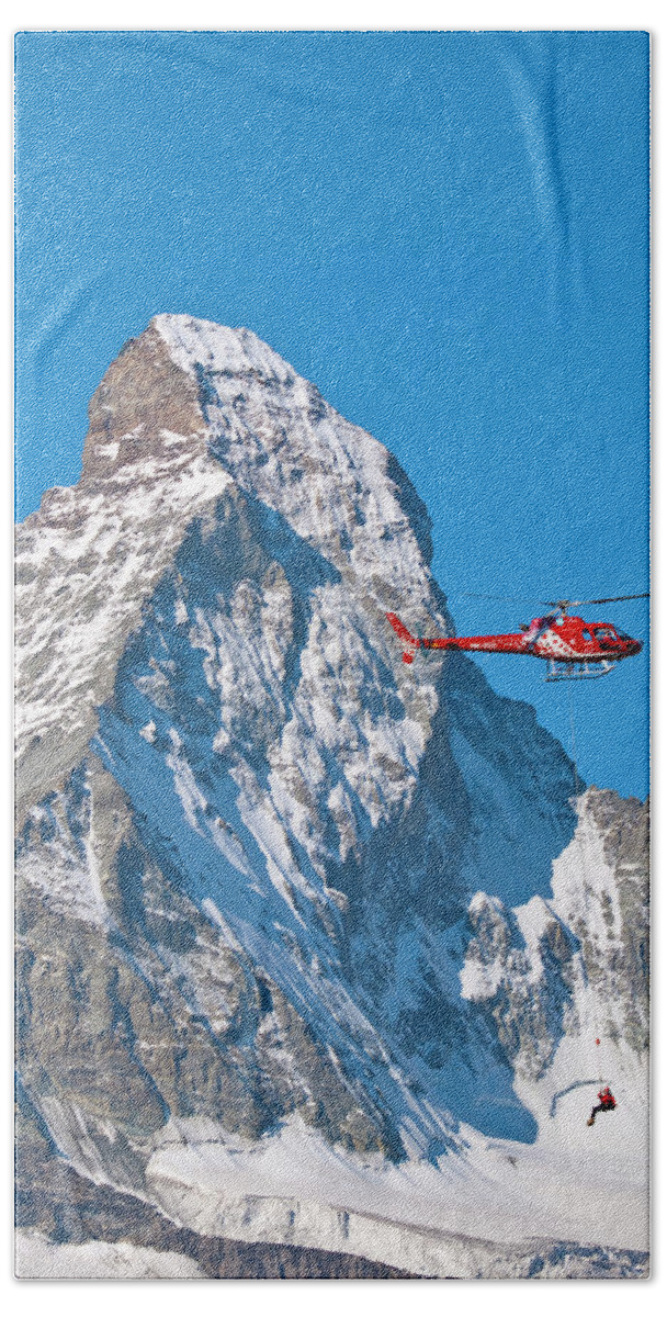 Mountaineer Bath Towel featuring the photograph A Rescue Working Is Dangling by Menno Boermans
