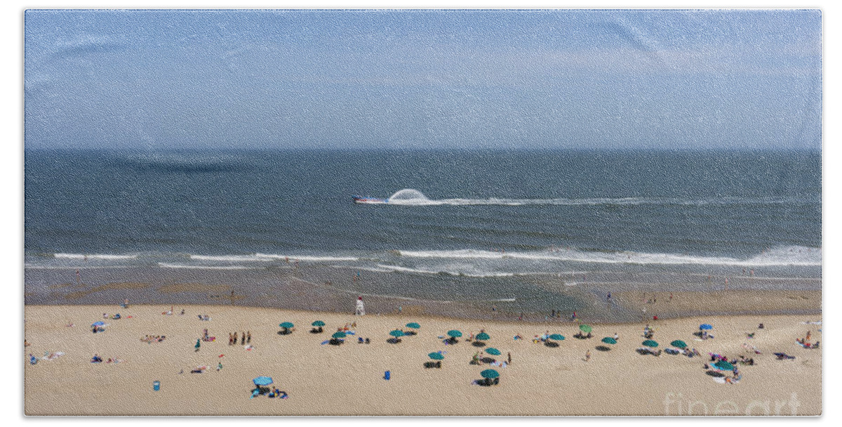 Atlantic Bath Towel featuring the photograph A touring speedboat passes by shore in Ocean City Maryland by William Kuta