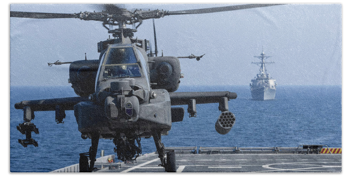 Military Bath Towel featuring the photograph An Army Ah-64d Apache Helicopter Takes by Stocktrek Images
