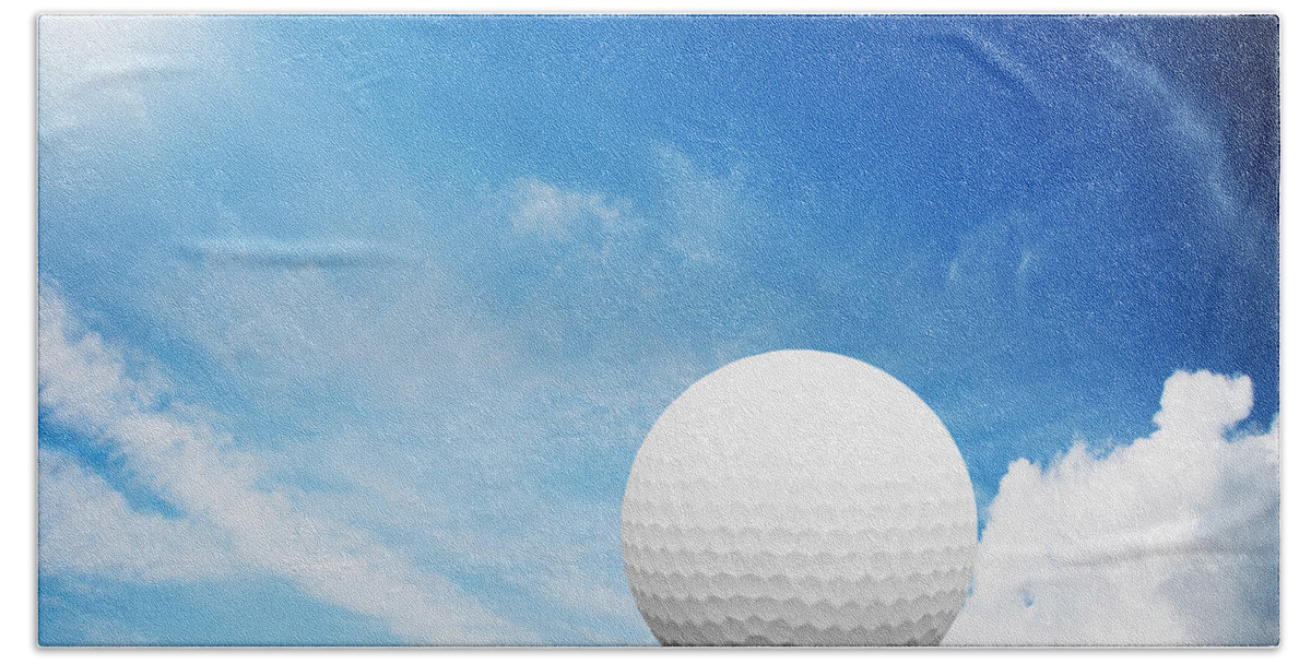 Golf Bath Towel featuring the photograph Ball on tee on green golf field by Michal Bednarek