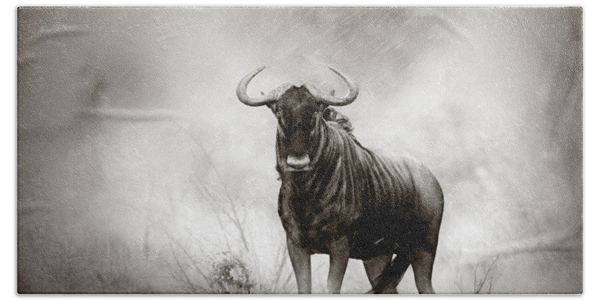 Blue Hand Towel featuring the photograph Blue Wildebeest in rainstorm by Johan Swanepoel