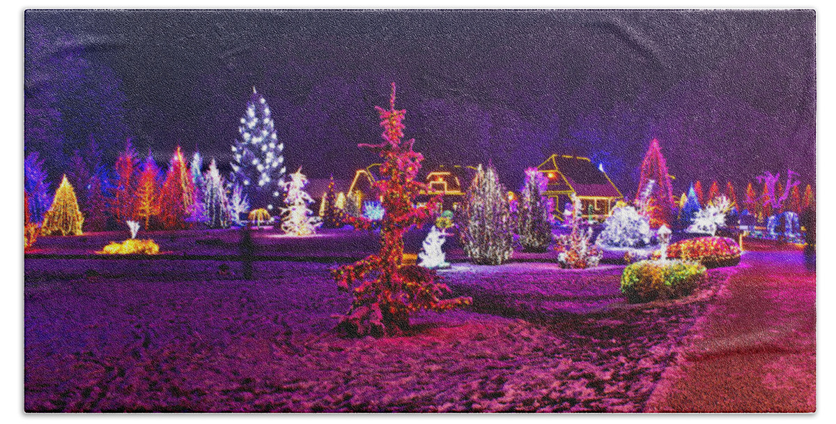 Christmas Hand Towel featuring the mixed media Christmas lights in town park - fantasy colors by Brch Photography