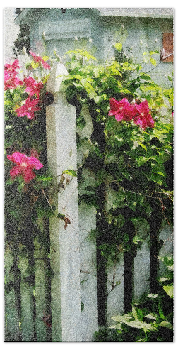 Clematis Bath Towel featuring the photograph Clematis on Fence by Susan Savad
