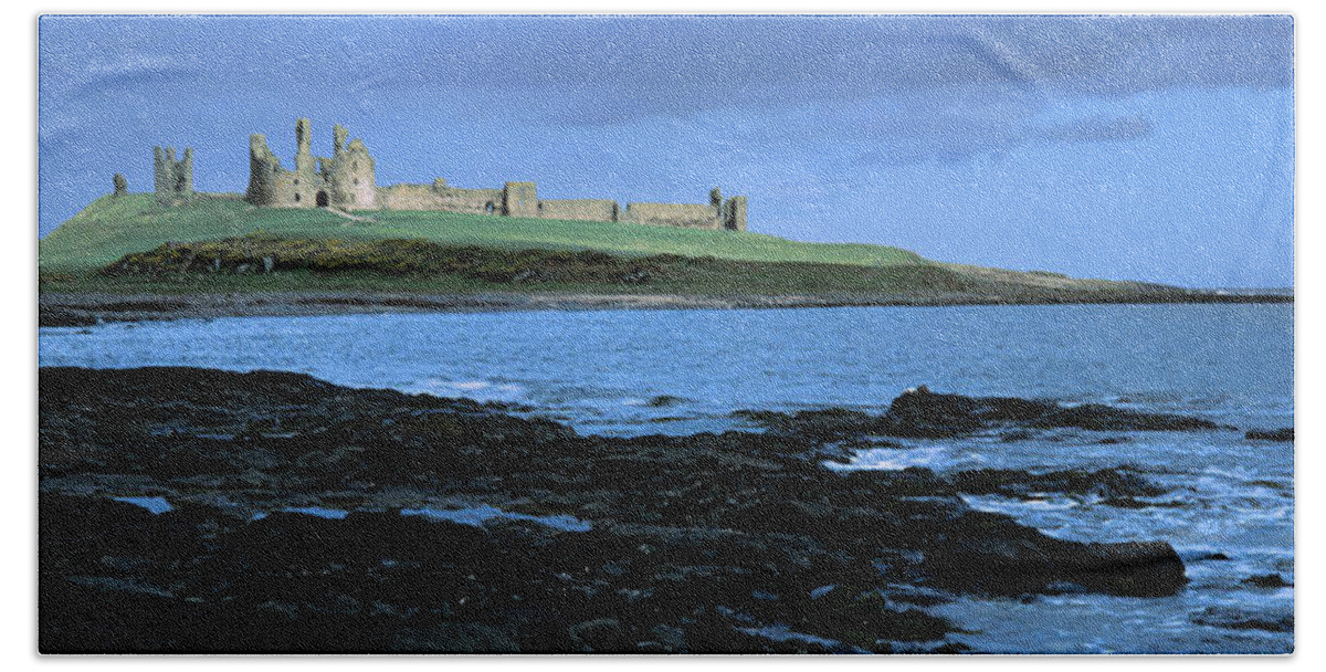 Photography Hand Towel featuring the photograph Dunstanburgh Castle At The Coast by Panoramic Images