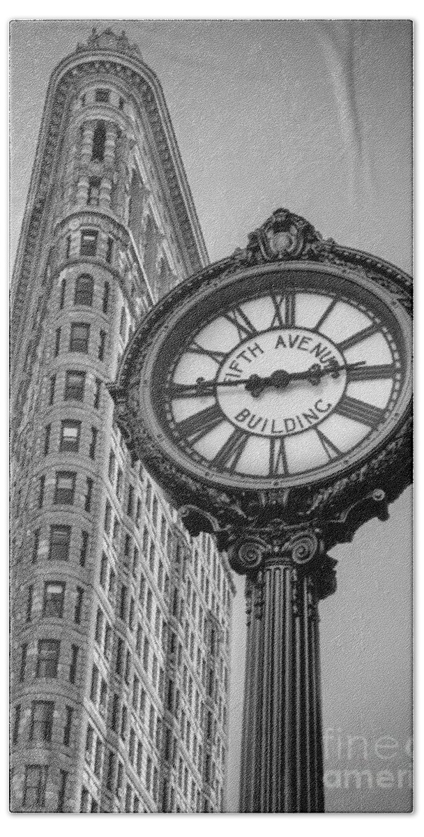5th Ave. Bath Towel featuring the photograph Flatiron and Clock Black and White by Jerry Fornarotto