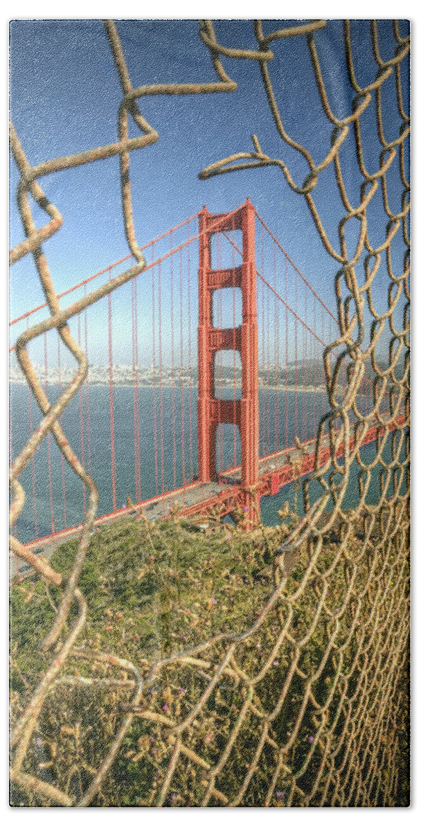 Golden Gate Hand Towel featuring the photograph Golden Gate through the fence by Scott Norris