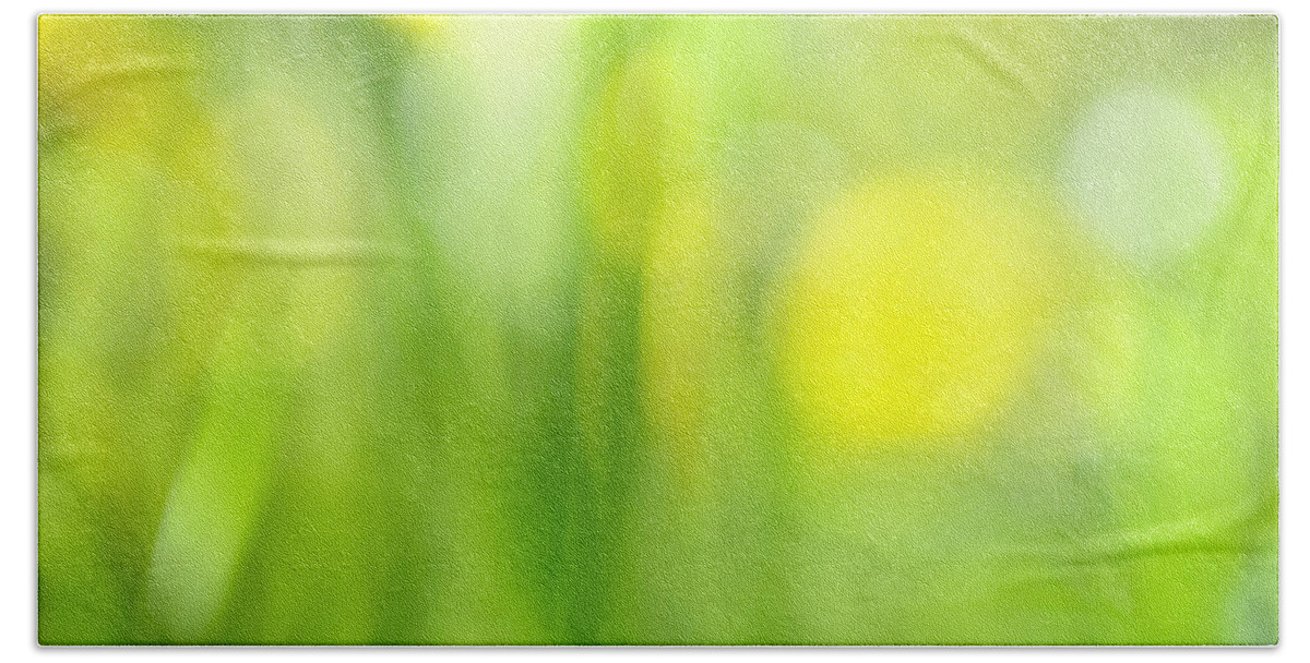 Green Hand Towel featuring the photograph Green grass with yellow flowers abstract by Elena Elisseeva