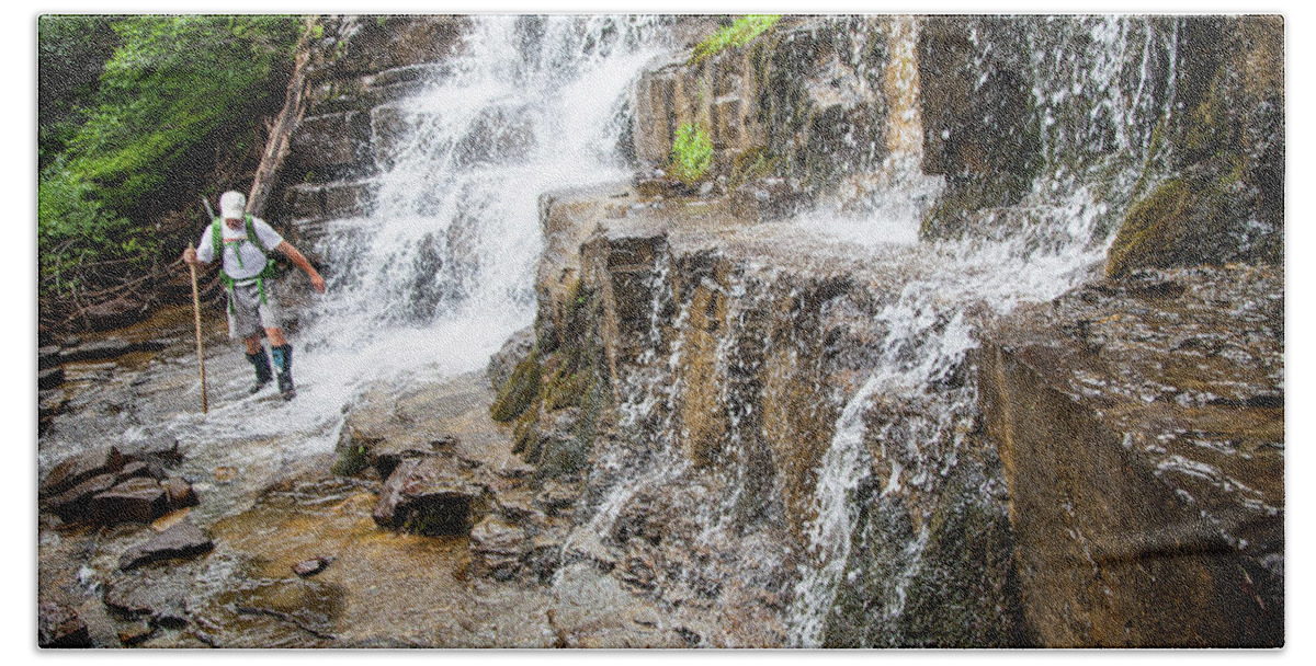 Usa Bath Towel featuring the photograph Hiker Crossing Stream Below Waterfall by Robin Carleton