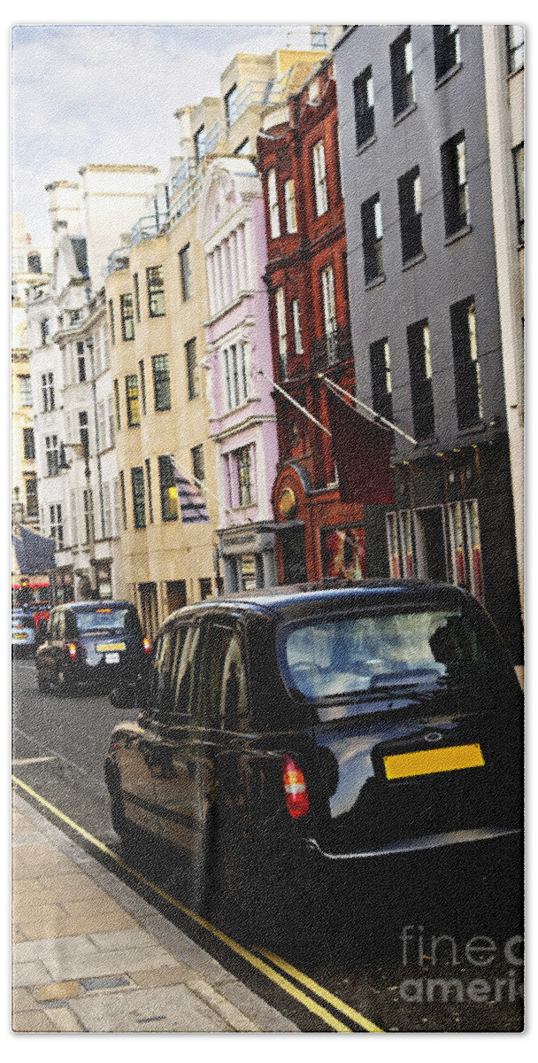 London Bath Towel featuring the photograph London taxi on shopping street by Elena Elisseeva