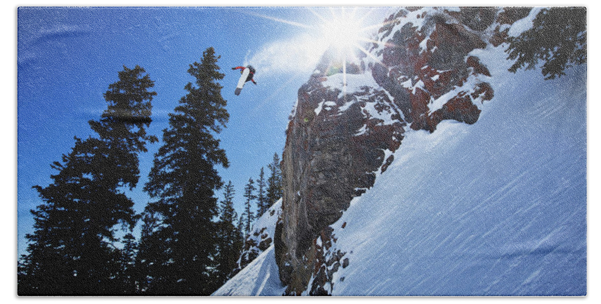 Adventure Hand Towel featuring the photograph Male Snowboarder Spins Off A 60 Foot by Patrick Orton
