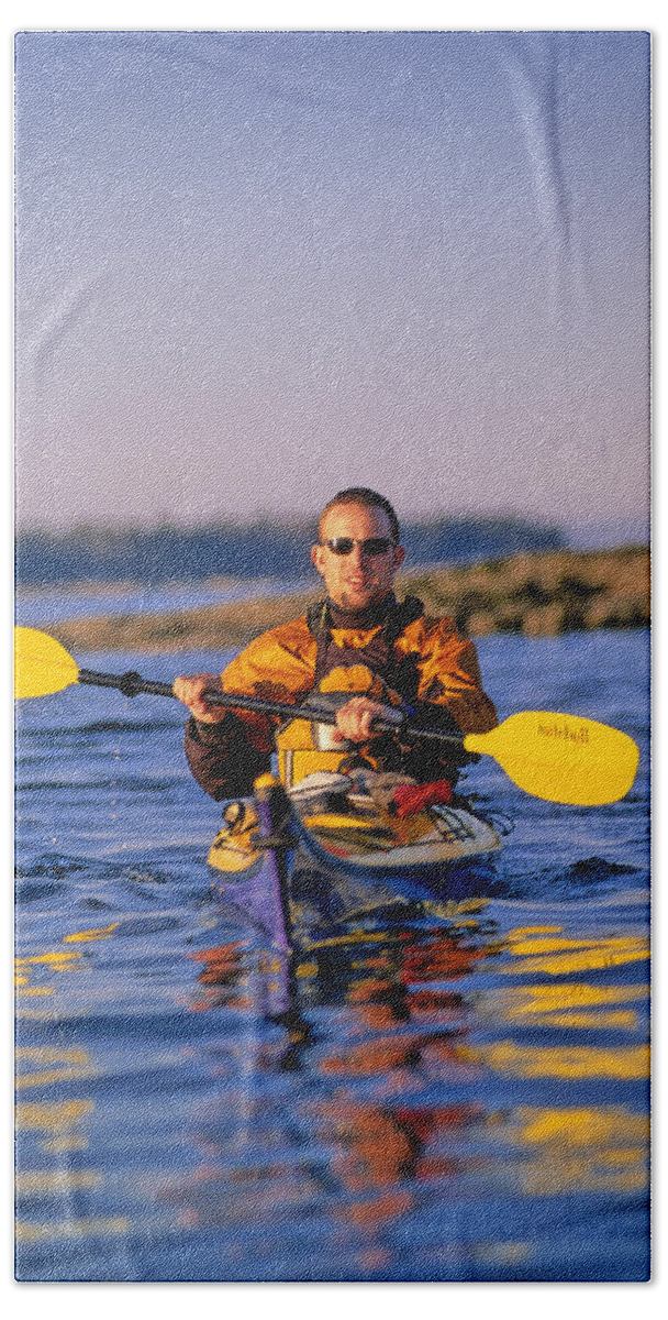 Acadia National Park Bath Towel featuring the photograph Man Sea Kayaks In Penobscot Bay by Abrahm Lustgarten