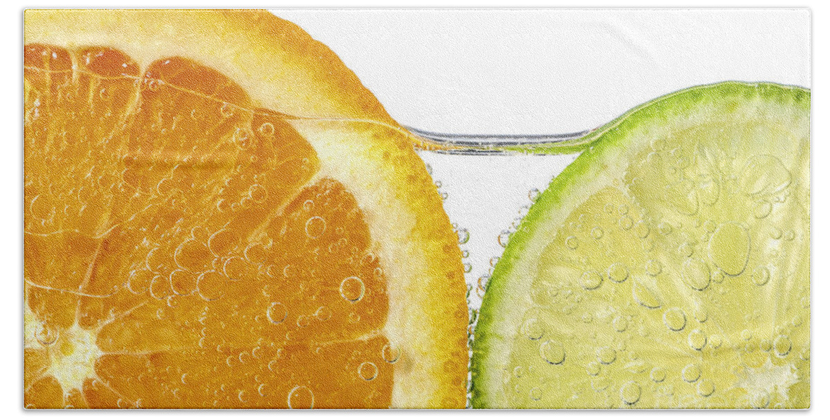 Orange Bath Sheet featuring the photograph Orange and lime slices in water by Elena Elisseeva
