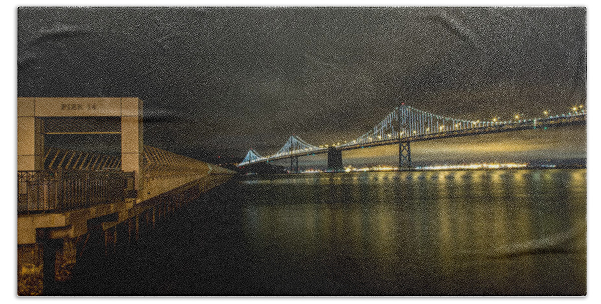 San Francisco Bath Towel featuring the photograph Pier 14 and Bay Bridge at Night by John Daly