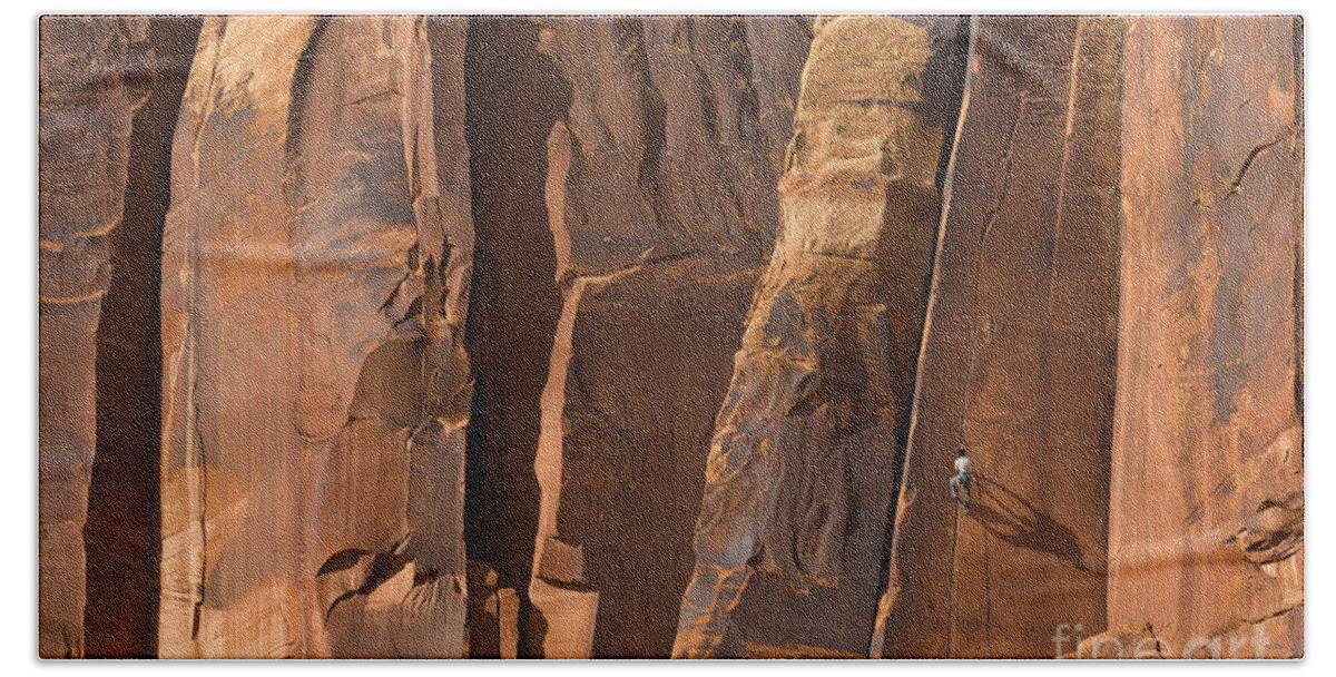 00559216 Bath Towel featuring the photograph Rock Climber Indian Creek Utah by Yva Momatiuk and John Eastcott