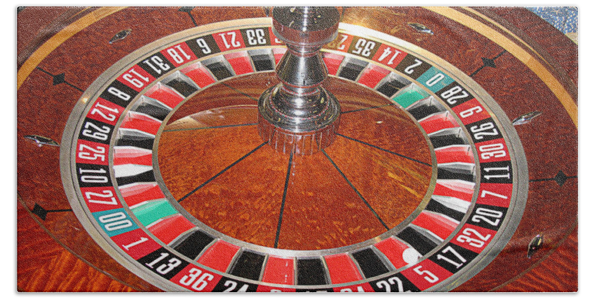 Casino Bath Towel featuring the photograph Roulette wheel and chips by Tom Conway